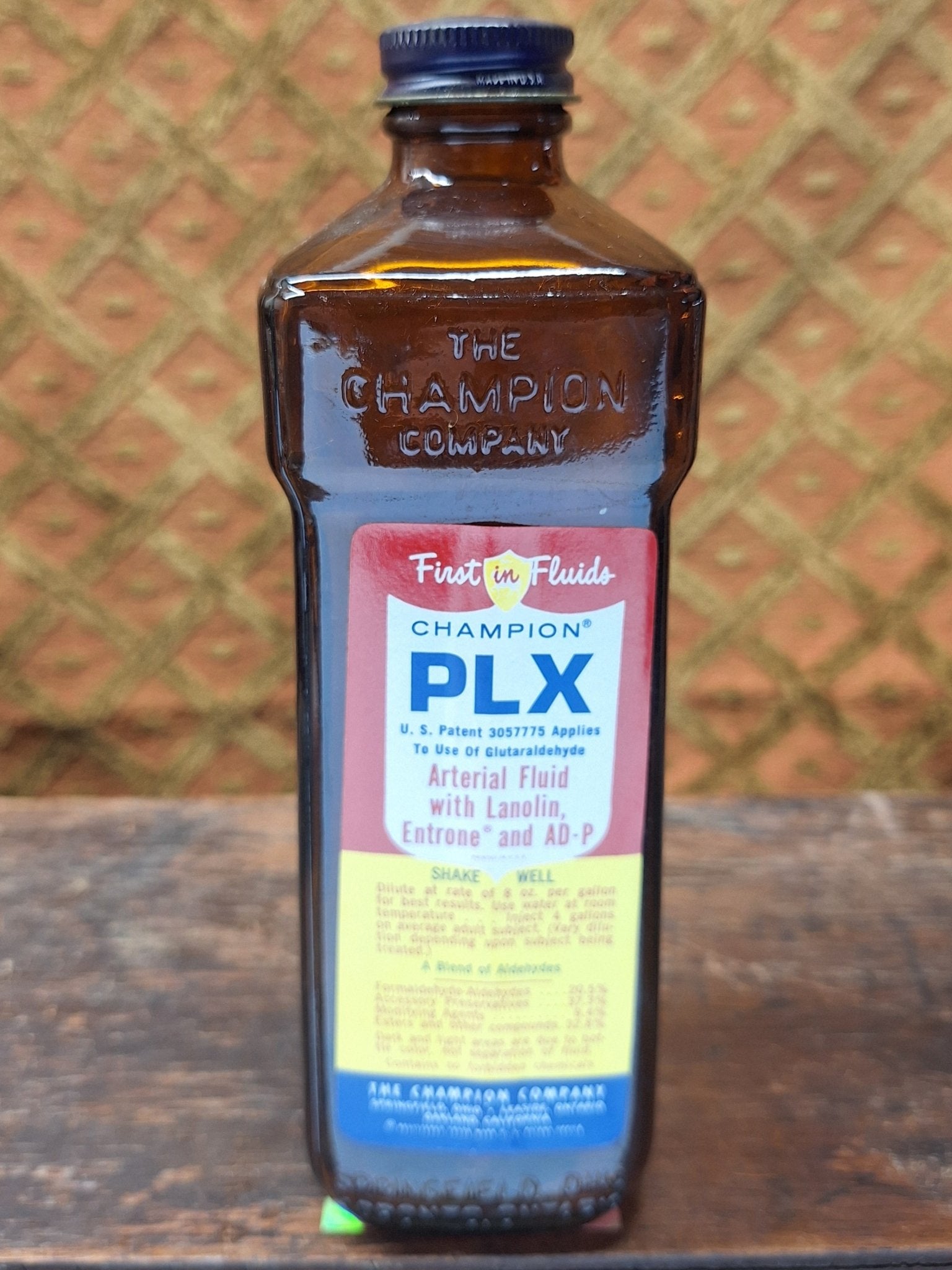 Champion First in Fluids PLX Vintage Embalming Bottle - Exquisite Dark Curio