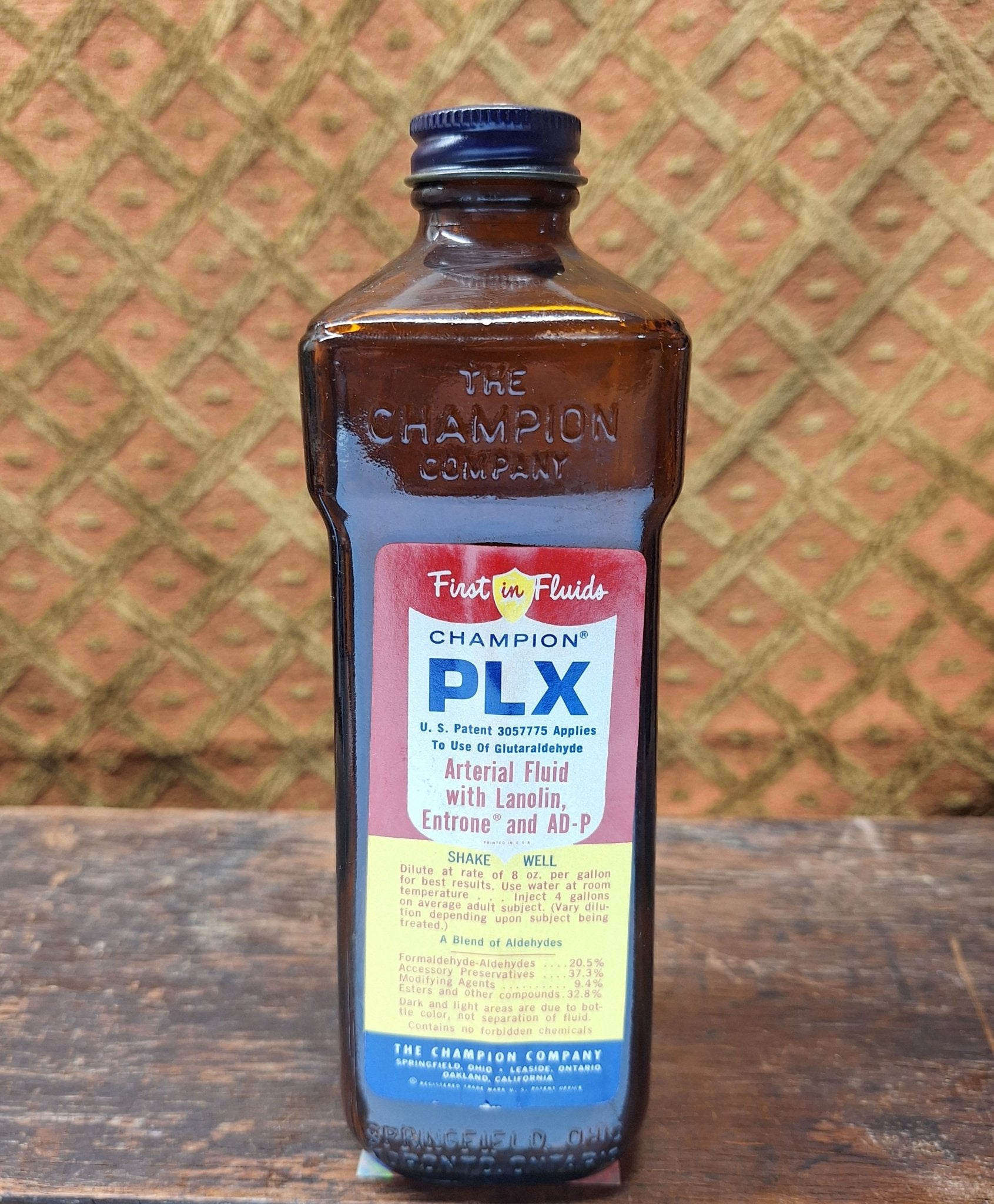 Champion First in Fluids PLX Vintage Embalming Bottle - Exquisite Dark Curio